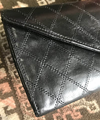 1980s. Vintage CHANEL black goatskin bill, card, checkbook long wallet pouch purse with mini CC motif. Classic unisex style.