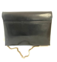 Vintage Gucci black leather shoulder bag with golden and silver tone GG logo motif. Classic purse. Can be clutch bag.