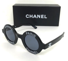 Vintage CHANEL black round frame mod sunglasses with white CHANEL PARIS logo. 060412