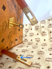 Vintage MCM classic brown monogram Kelly bag with golden logo plate. Perfect daily use bag. By Michael Cromber, Germany