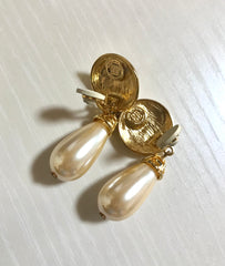 Vintage Givenchy golden round dangle earrings with teardrop faux pearl. Classic and beautiful jewelry piece.