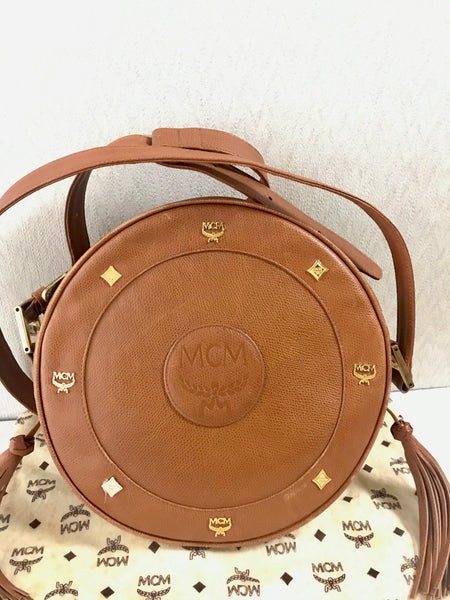 Vintage MCM suzy wong bag, brown grained leather round shoulder bag with  studs and fringes. Designed by Michael Cromer.