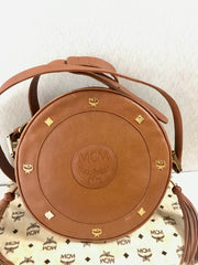 Vintage MCM suzy wong bag, brown grained leather round shoulder bag with studs and fringes. Designed by Michael Cromer. Nature. 060531r8