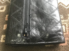 1980s. Vintage CHANEL black goatskin bill, card, checkbook long wallet pouch purse with mini CC motif. Classic unisex style.
