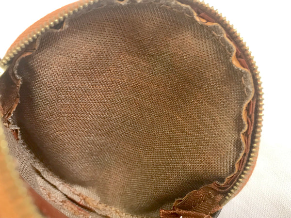 Vintage MCM brown monogram round shape coin case with tassel. Mini