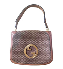 Vintage Gucci brown leather micro GG print shoulder bag with iconic golden large round GG motif. Rare masterpiece purse.