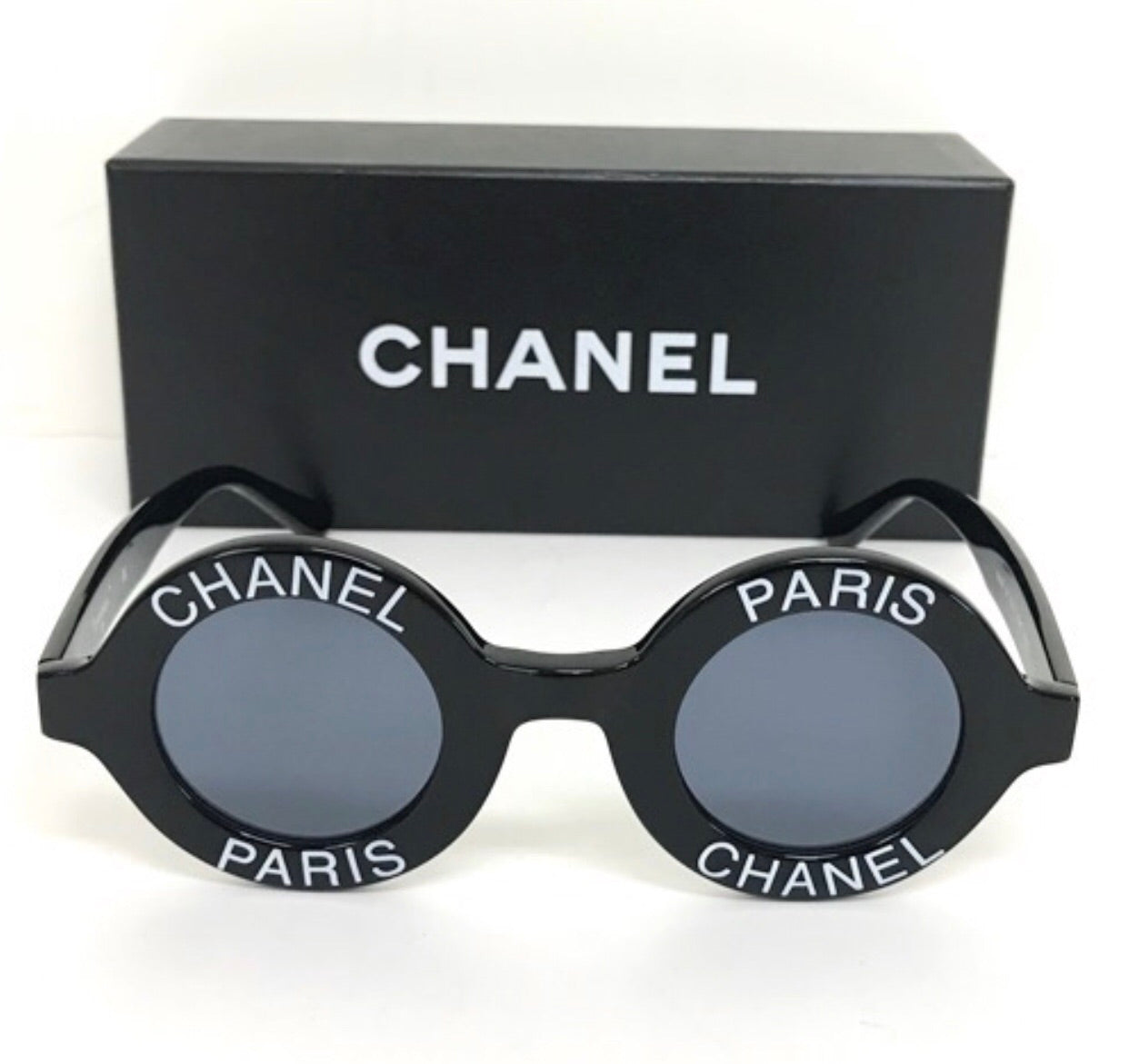 Vintage CHANEL black round frame mod sunglasses with white CHANEL PARIS logo. 060412