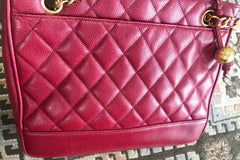 Vintage CHANEL cherry red caviar leather quilted shoulder bag, tote with golden CC ball and chain straps. Classic bag.