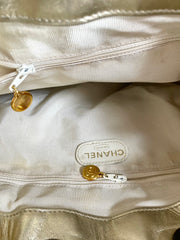 Vintage CHANEL campaign gold lamb leather hobo bucket bag with marble hoop handles and turn lock CC. 0412081