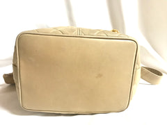 Vintage CHANEL beige quilted lamb leather hobo bucket shoulder bag with drawstrings and golden CC mark ball. 050320r3