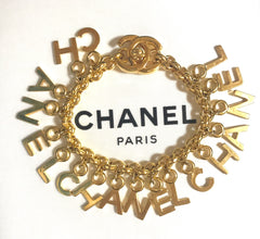 Vintage Chanel Turnlock CC closure and CHANEL letter dangle bracelet. Must have 90s jewelry. CC and logo letter charm bracelet.