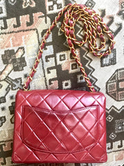 Vintage CHANEL deep red lambskin mini 2.55 bag with golden CC and chain strap. Classic Chanel red bag back in the era.