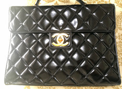 1990s. Vintage CHANEL black patent enamel briefcase business bag with golden large CC motif. Classic and traditional masterpiece you must have.