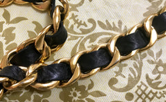 1980s Vintage CHANEL black leather thick chain belt with golden CC and mademoiselle charm. Nice and heavy single layer belt from CHANEL.
