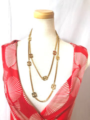 Vintage Lanvin golden chain long necklace with logo motif charms. Rare Lanvin vintage jewelry. Long necklace. 0403311