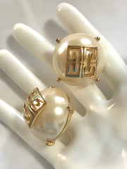 Vintage Givenchy extra large round pearl earrings with logo mark. Gorgeous jewelry piece.