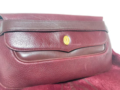Vintage Cartier wine leather clutch bag with gold tone logo motif. Classic purse from must de Cartier Collection. 060926re8