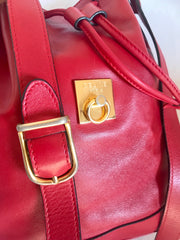 Vintage Celine red leather hobo bucket shoulder bag with a golden square logo motif and matching pouch. Classic drawstrings purse.