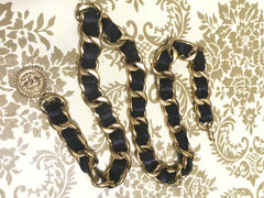 1980s Vintage CHANEL black leather thick chain belt with golden CC and mademoiselle charm. Nice and heavy single layer belt from CHANEL.