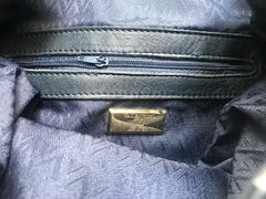Vintage Valentino navy leather hobo bucket shoulder bag with embossed V logo and drawstring. Classic daily use bag.