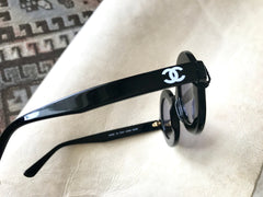 Vintage CHANEL black round frame mod sunglasses with white CHANEL PARIS logo. 060412