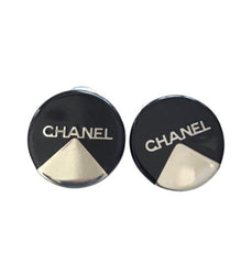 Vintage Chanel round earrings with silver and black mod design.