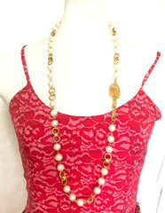 Vintage CHANEL golden chain and faux pearl long necklace with arabesque CC mark motif. Can be double or used as a belt as well.