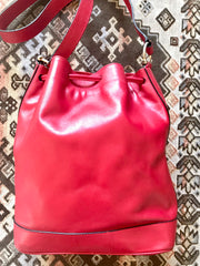 Vintage Celine red leather hobo bucket shoulder bag with a golden square logo motif and matching pouch. Classic drawstrings purse.