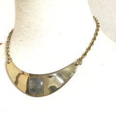 Vintage Celine gold tone crescent moon shape necklace with silver triomphe logo. 05062810