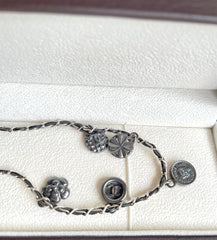 MINT. Vintage CHANEL skinny silver chain necklace with symbolic coin charms and black leather. Can be bracelet too. 060531r1