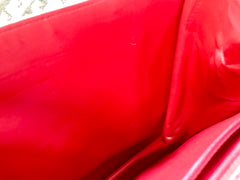 Vintage Valentino Garavani orange red leather clutch shoulder bag with a large gathered buckle design flap and V motif. Must have.