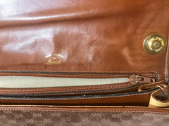 Vintage Gucci brown leather micro GG print shoulder bag with iconic golden large round GG motif. Rare masterpiece purse.