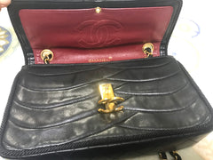 80's vintage Chanel black 2.55 shoulder bag with wavy stitches and rope strings and gold chain strap. Very rare piece from the era