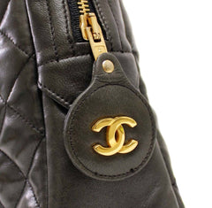 Vintage CHANEL black lamb leather large classic bag with double golden chain strap and a CC pull charm. Perfect daily bag.