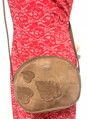 Vintage Longchamp brown suede leather oval round shape shoulder bag with leaf applique motifs. Rare and unique bag back in the okd era.