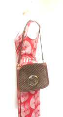 Vintage Gucci brown leather micro GG print shoulder bag with iconic golden large round GG motif. Rare masterpiece purse.
