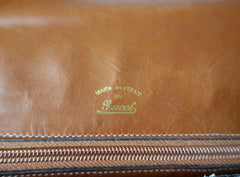 Vintage Gucci brown leather micro GG print shoulder bag with iconic golden large round GG motif. Rare masterpiece purse.