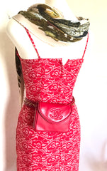 Vintage CHANEL red leather belt bag, fanny pack with detachable chain belt and CC stitch mark on flap. Fits 29.5" through 32.8"