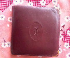 Vintage Cartier, must de Cartier wine leather square wallet with gold tone frames. Unisex use.