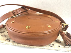 Vintage MCM suzy wong bag, brown grained leather round shoulder bag with studs and fringes. Designed by Michael Cromer. Nature. 060531r8