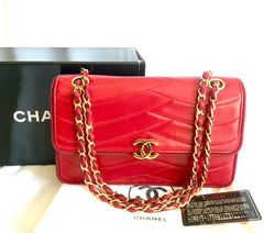 Vintage Chanel red 2.55 shoulder bag with wavy stitches and rope strings and gold chain strap. Very rare piece from the era. 050316r4