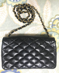 80's vintage CHANEL black lambskin shoulder bag with golden large CC closure and beak tip flap tip. Classic 2.55 bag