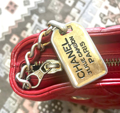 Vintage CHANEL lipstick red quilted lambskin leather trapezoid shape tote bag with a gold CC plate and chains.
