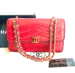 Vintage Chanel red 2.55 shoulder bag with wavy stitches and rope strings and gold chain strap. Very rare piece from the era. 050316r4