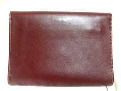 Vintage Cartier wine leather clutch bag, mini document purse with logo motif. Unisex bag from must de Cartier Collection.