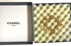 Vintage Chanel Turnlock CC closure and CHANEL letter dangle bracelet. Must have 90s jewelry. CC and logo letter charm bracelet.