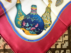 Vintage HERMES Carre large silk scarf with blue, yellow, green, pink, multicolor perfume bottle print in wine. Qu' importe le flacon.
