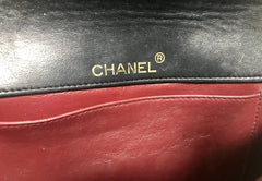 80's vintage CHANEL black lambskin shoulder bag with golden large CC closure and beak tip flap tip. Classic 2.55 bag