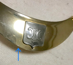 Vintage Celine gold tone crescent moon shape necklace with silver triomphe logo. 05062810