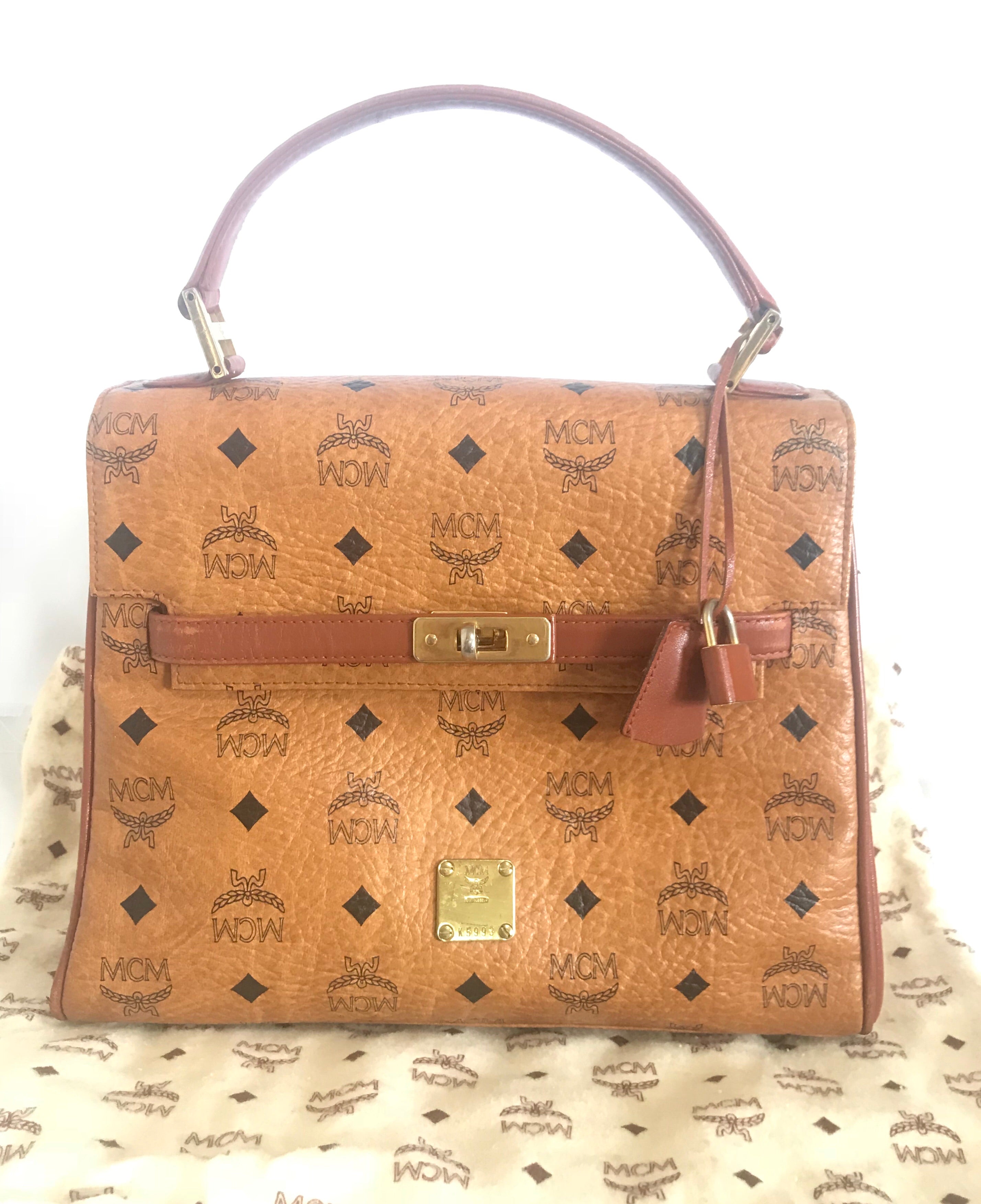 Vintage MCM classic brown monogram Kelly bag with golden logo plate. Perfect daily use bag. By Michael Cromber, Germany